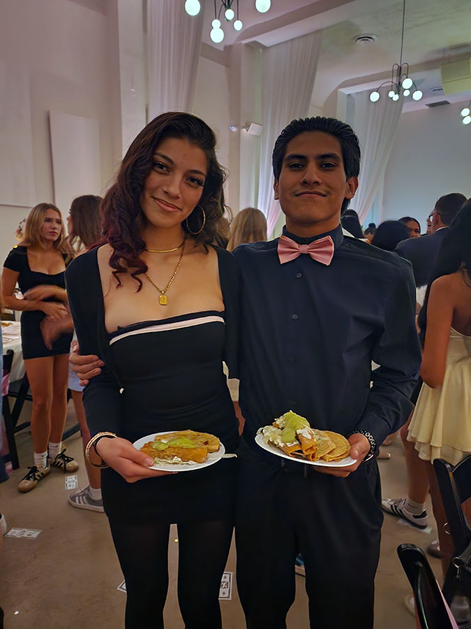 Salsa and toppings bar set up at an outdoor quinceañera