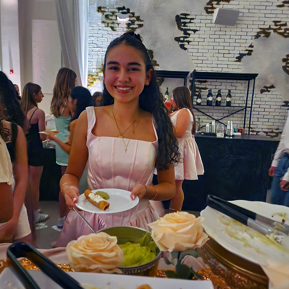 Tacos Don Jorge staff serving the taco buffet bar at an indoor reception