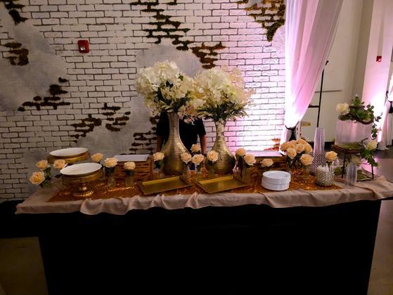 Elegant ivory and gold decorated station with fresh flowers