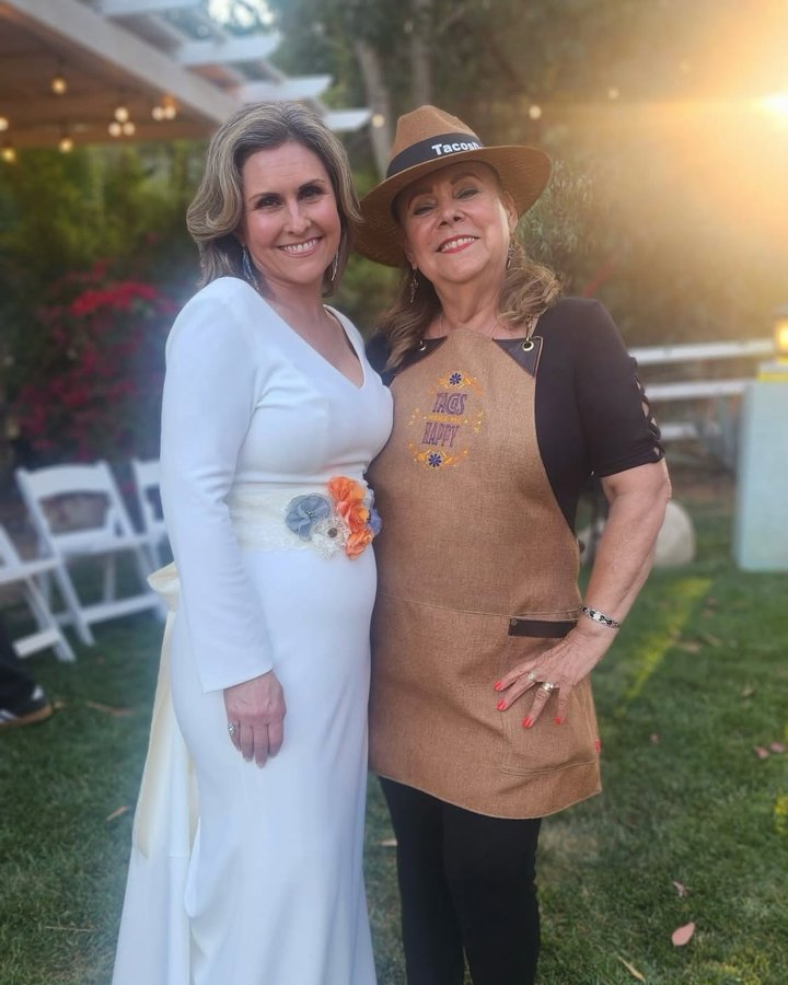 Lupita with a bride in a garden wedding