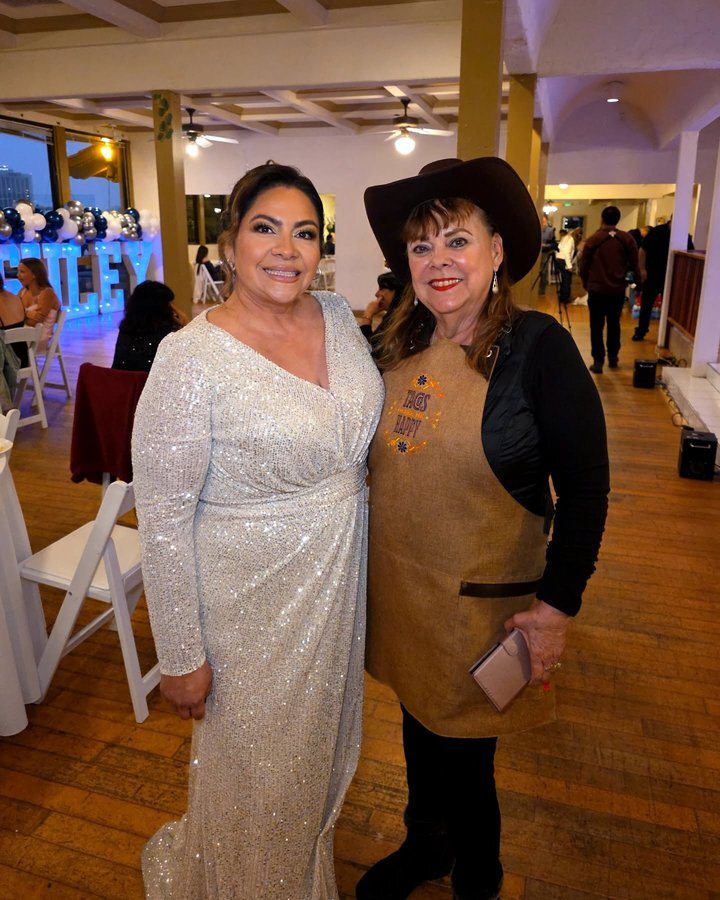 Lupita with a bride at a Tacos Don Jorge wedding reception