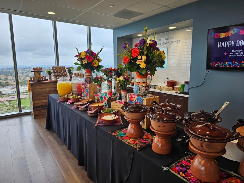 Taco buffet bar station with fresh flowers and handmade tortillas
