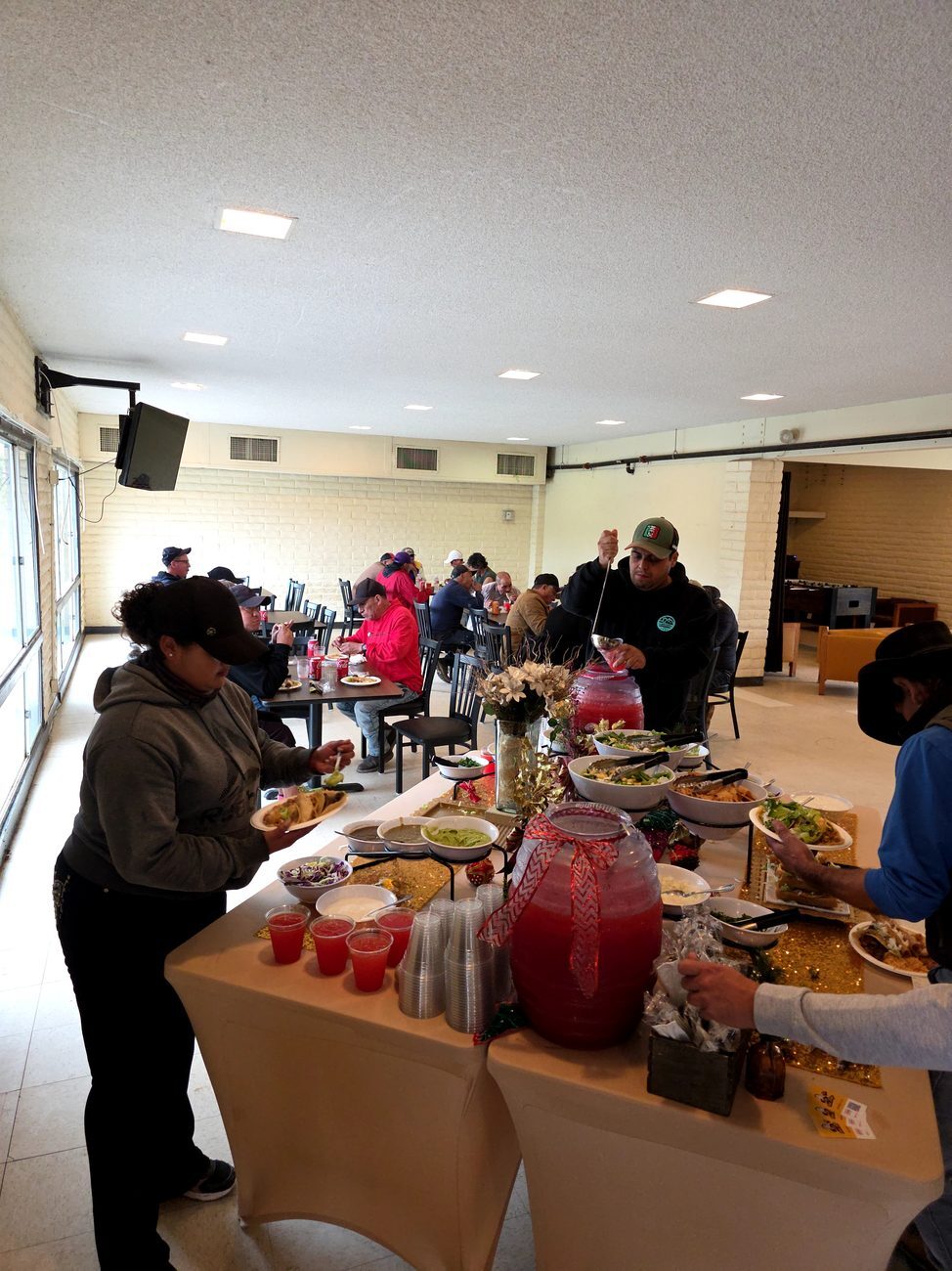 Guests enjoying a Taco Festival celebration indoors