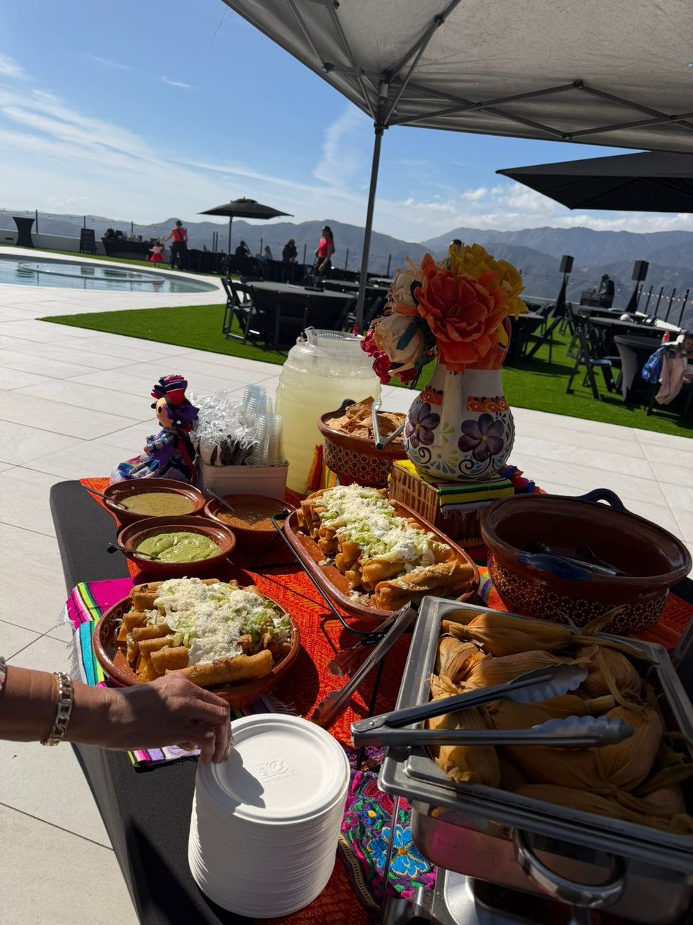 Taco Festival buffet set up on a rooftop with mountain views